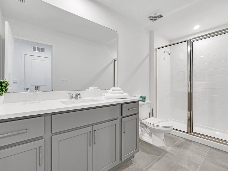 Enjoy comfort and privacy in this modern ensuite bathroom.