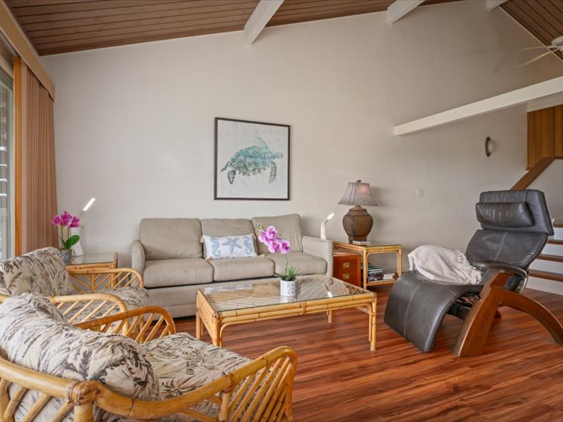 he spacious living room blends island charm with comfort