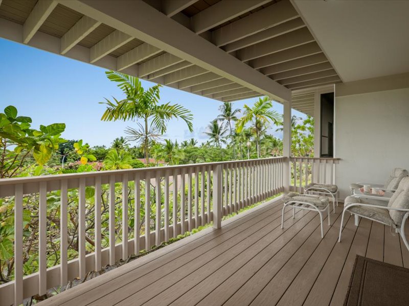 Step out from the primary bedroom onto your private lanai and enjoy peaceful views of swaying palms and lush greenery