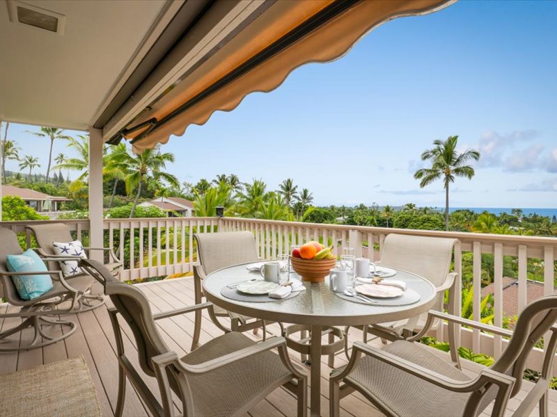 Savor ocean breezes and tropical views from this spacious lanai, complete with an outdoor dining table and adjustable shade awning