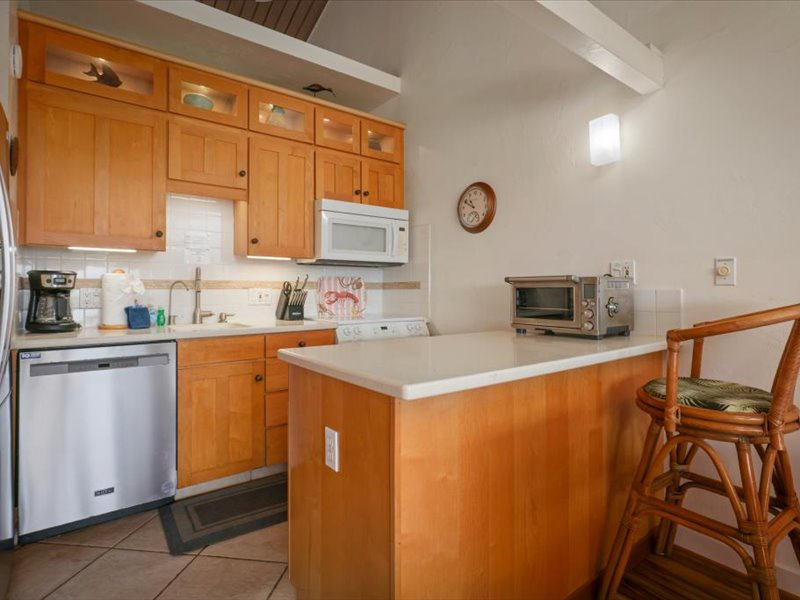This bright, open kitchen is fully equipped for easy vacation living