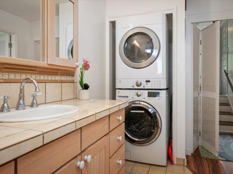 Enjoy the convenience of a full-size, in-unit washer and dryer tucked neatly beside the primary bathroom