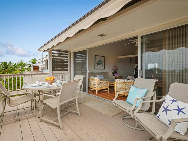 Enjoy island living on the expansive main lanai, perfect for outdoor dining and relaxing in the gentle ocean breeze