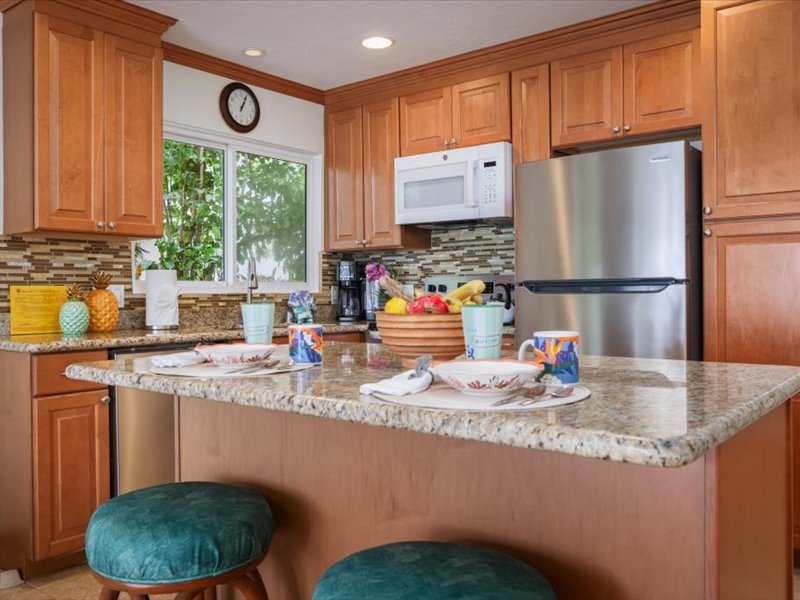 Inviting kitchen with granite countertops, stainless steel appliances, and a breakfast bar perfect for casual dining.