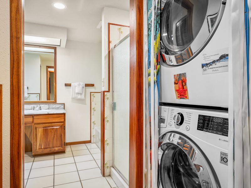 Pack light and stay fresh with a full-size washer and dryer tucked just off the bathroom