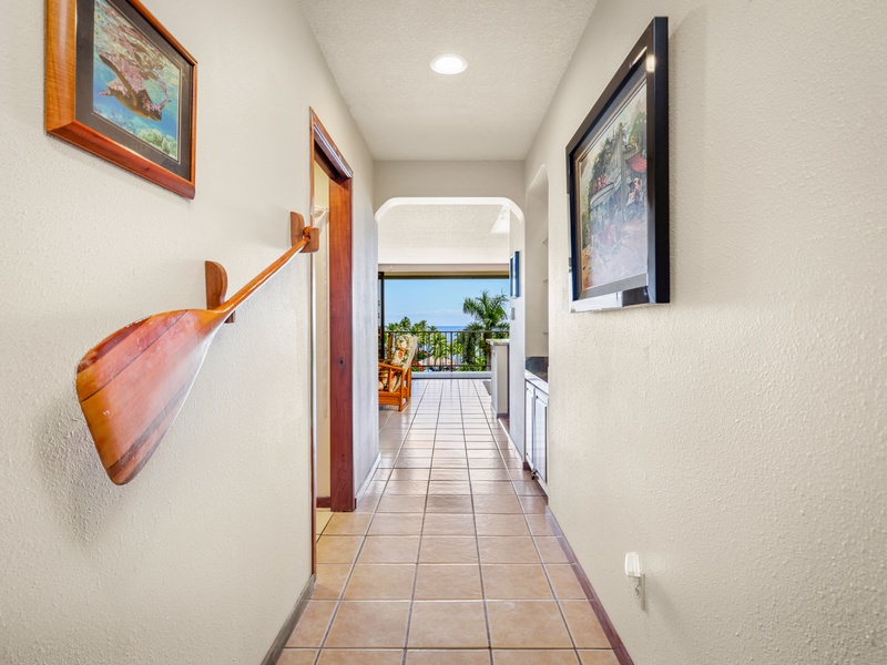 Step inside and enjoy a welcoming entrance adorned with Hawaiian décor, leading to your private lanai with beautiful ocean views