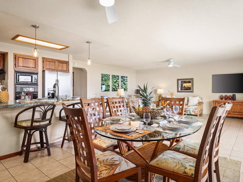 This bright, breezy space features tropical dining for six, a fully equipped kitchen with bar seating, and a cozy living area with island-style decor and a large, smart TV