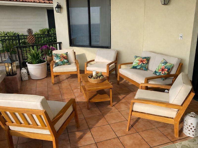 Inviting tropical lanai with comfortable seating