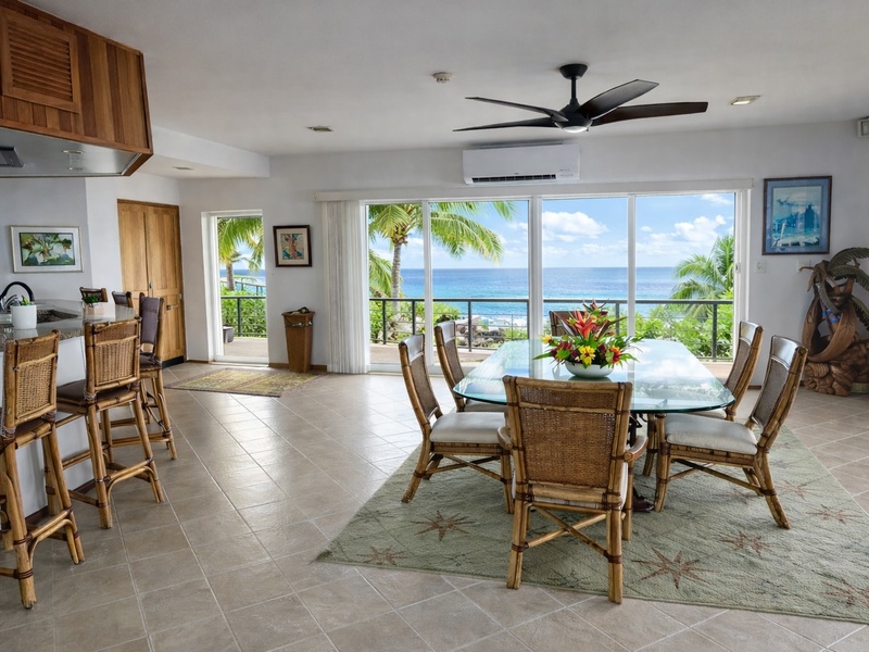 Bright oceanview dining with indoor–outdoor island living