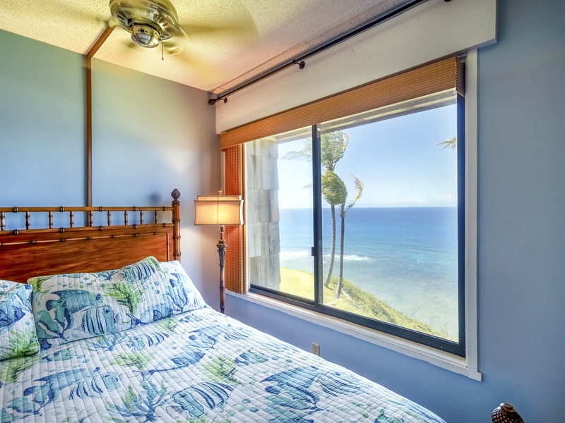 The downstairs master bedroom is a peaceful and cozy retreat, with gorgeous ocean views you don't even have to get out of bed to enjoy!
