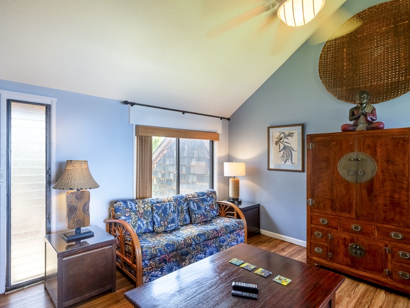 The living room is the perfect comfy spot to rest and relax after a long day exploring the island. You'll find a cable TV inside the entertainment center, and there's highspeed WiFi if you'd like to stream on your laptop/tablet.