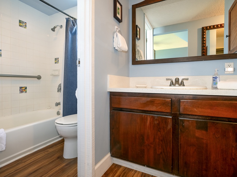 The downstairs master bedroom has a full ensuite bathroom, complete with a well-lit vanity area and plenty of space for your toiletries!