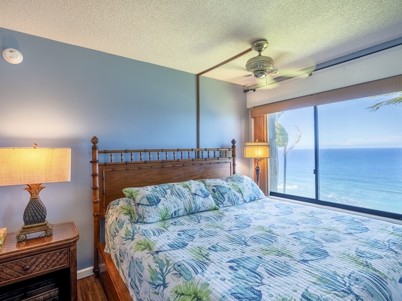 The downstairs master bedroom is decorated in calming shades of cool blue, to make you feel as though the ocean just outside your window is filling the whole space!