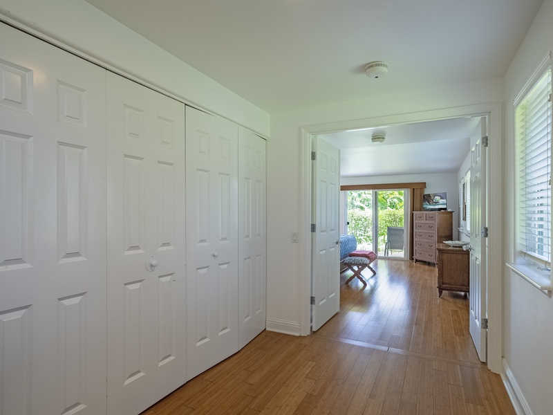 The downstairs hallway has a full size washer and dryer behind the closet doors, and the grand master suite has double doors that can be closed for additional privacy and soundproofing. 