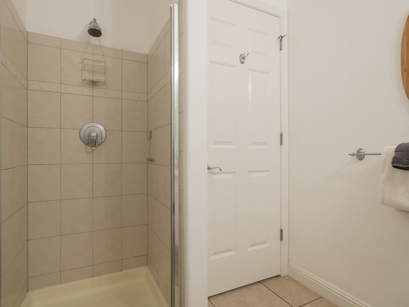 To the left of the entryway upstairs, you'll find a full guest bathroom, complete with a walk-in shower. 