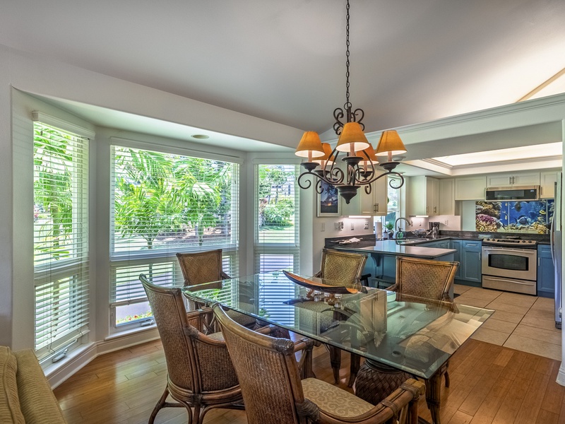 The open concept kitchen, dining, and living area make for an easy flow of conversation and activity, while the breakfast bar seating gives you options for quick bites!