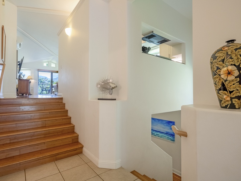 As you enter the home, the stairway to the right will take you down to the laundry area, and the grand master suite. 