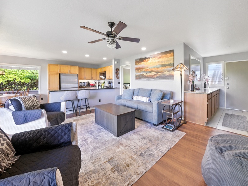 Unit 132's cozy living area, which leads out to the private lanai on the left. Plenty of windows fill the space with natural light, as well as letting in the trade winds to cool the space. 