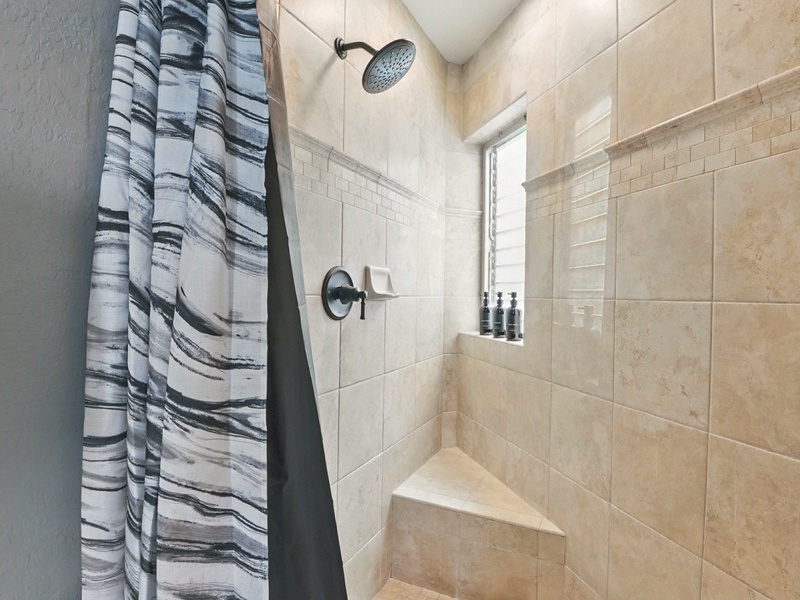 The walk-in shower, complete with rainfall showerhead and louvred window to let the steam out after a hot rinse!