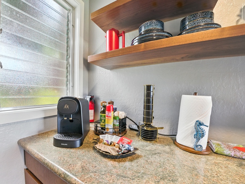 Unit 131's coffee setup and welcome kit, which includes several individual servings of ground coffee, 2 packs of powdered laundry detergent, granola bars, and a few other goodies for you to enjoy!