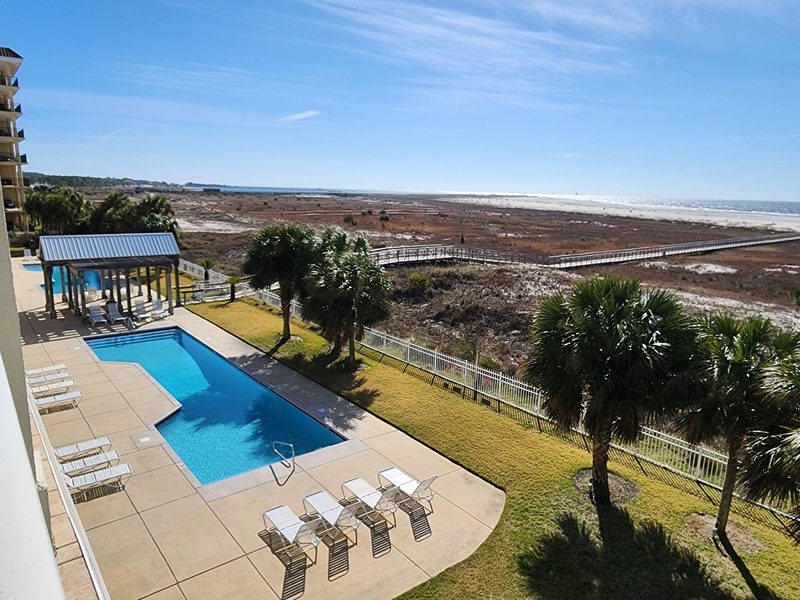 view of pools & beach