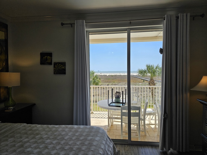 curtains drawn showing view of ocean