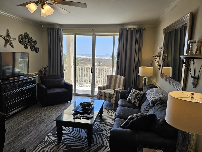 living room with view of beach and ocean