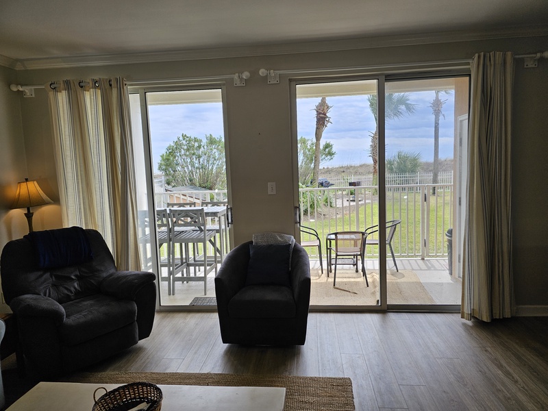 Living Room with View of Patio and Pool Area