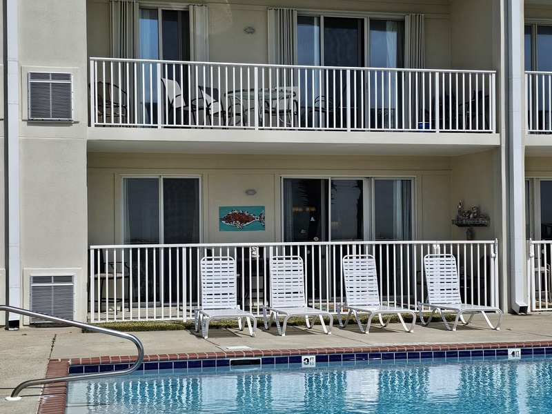 view of balcony from across pool