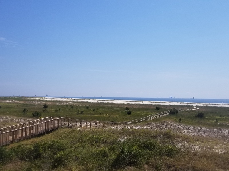 view of boardwalk & ocean