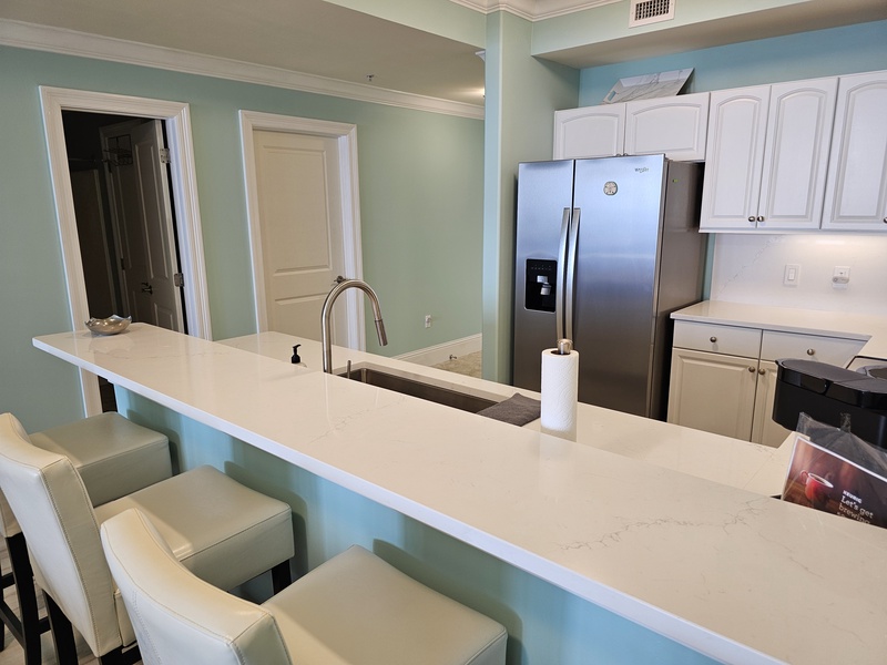 Bar in front of kitchen. 