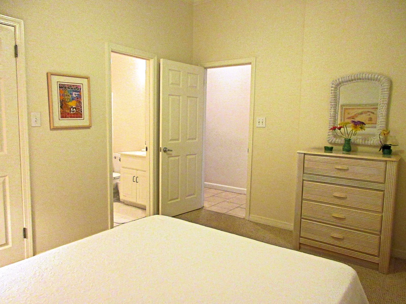 door to hallway and attached bathroom