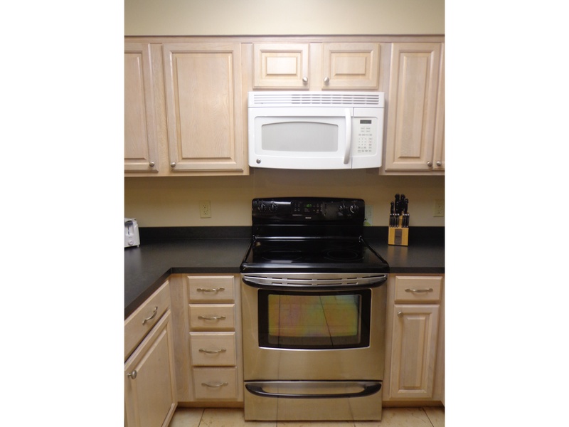 Full kitchen with coffee maker.