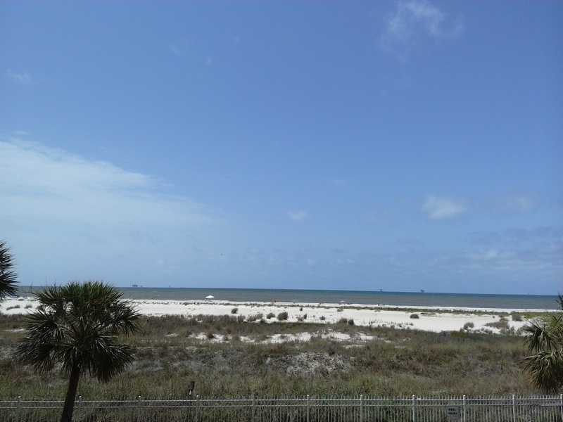 view of beach from railing of balcony