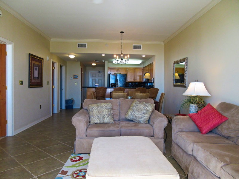 Full view of living room, dining area, and kitchen