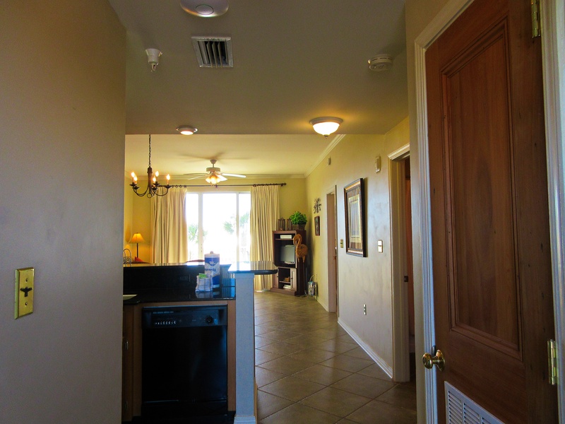 Entryway showing kitchen and dining area