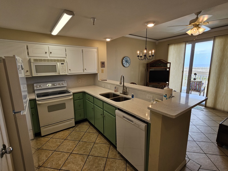 Kitchen with bar looking into the living area