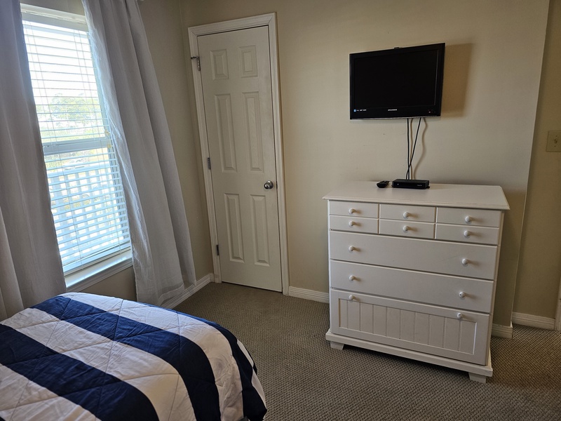 2nd bedroom with a window