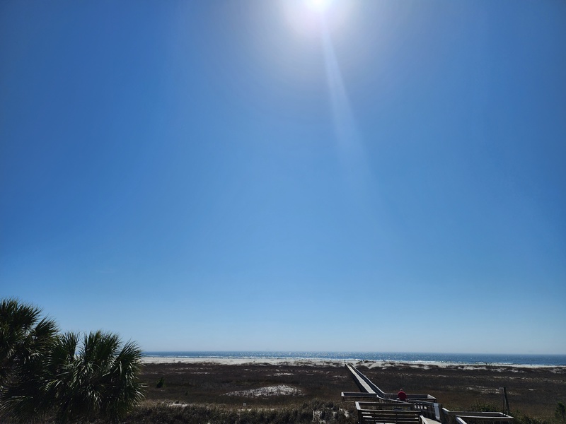 view of blue sky & beach