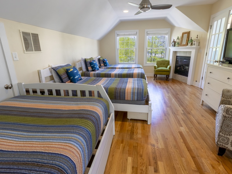 Second Level | Bedroom 2 | 1 Queen | 3 Twin | Attached 3/4 Bath