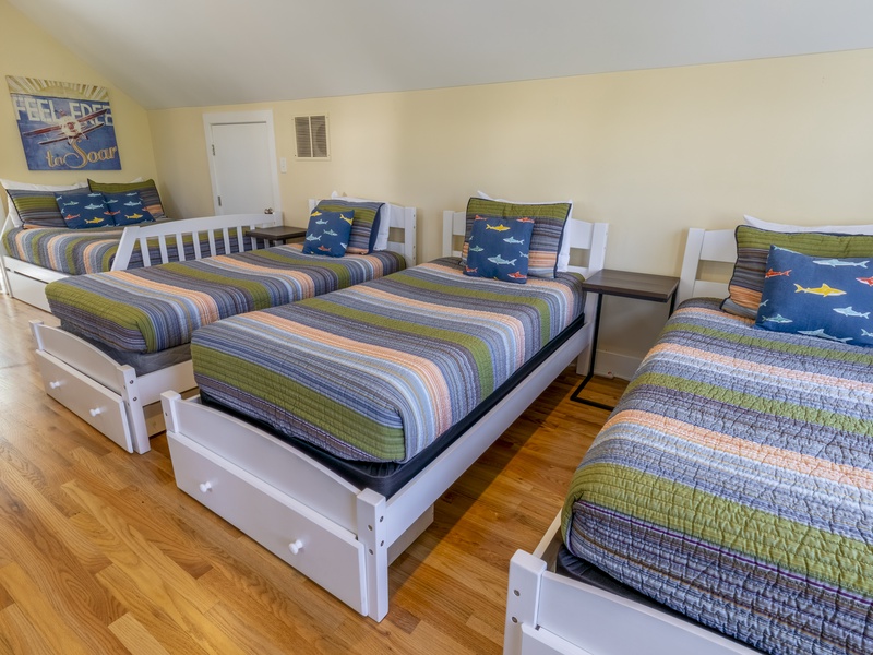 Second Level | Bedroom 2 | 1 Queen | 3 Twin | Attached 3/4 Bath