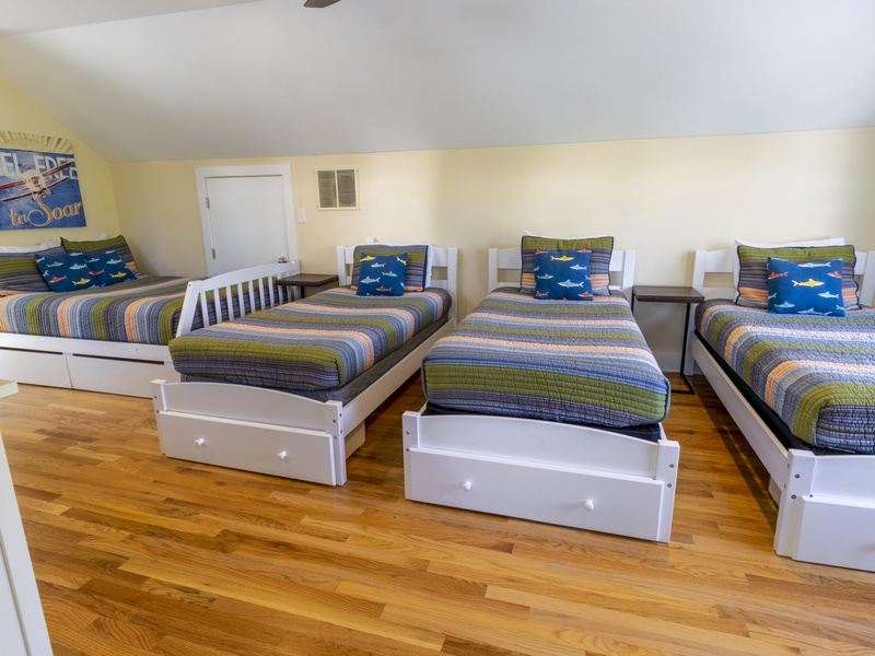 Second Level | Bedroom 2 | 1 Queen | 3 Twin | Attached 3/4 Bath
