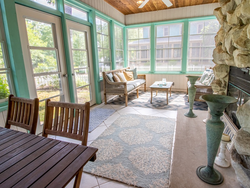 Main level 4 seasons porch with fireplace 