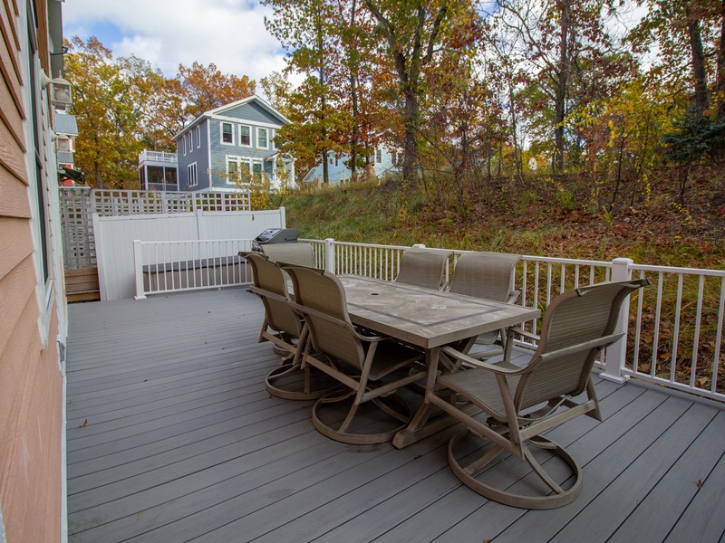 Back deck with seating for 6 and a grill