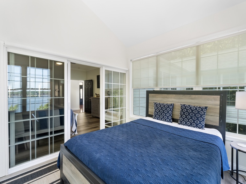 Queen bed in sunroom off bedroom 1