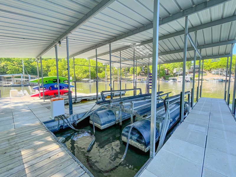 The dock with swim platform and kayaks
