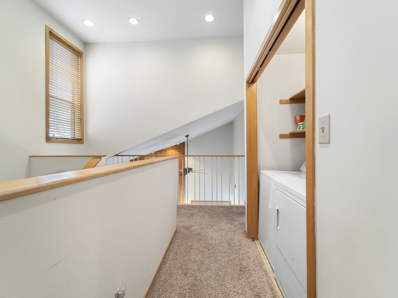 Upper level landing and laundry closet