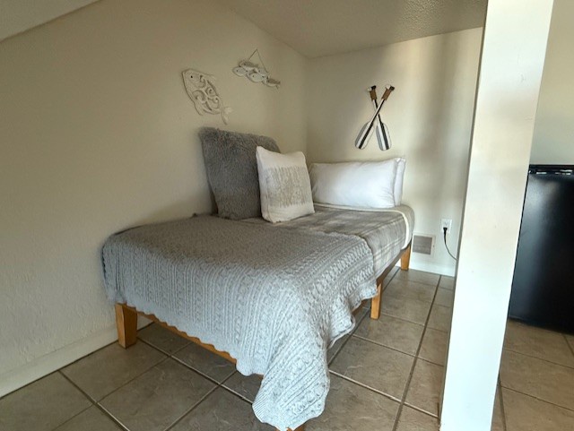 Twin bed in nook off lower level living area