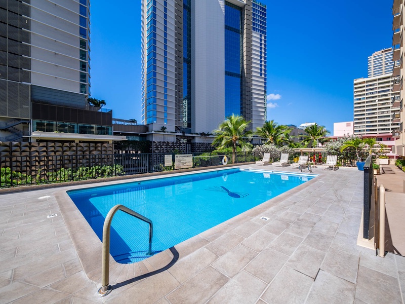Enjoy the best of island leisure at the Four Paddle pool deck—ample seating, sunny views, and tropical calm right in the heart of Honolulu.
