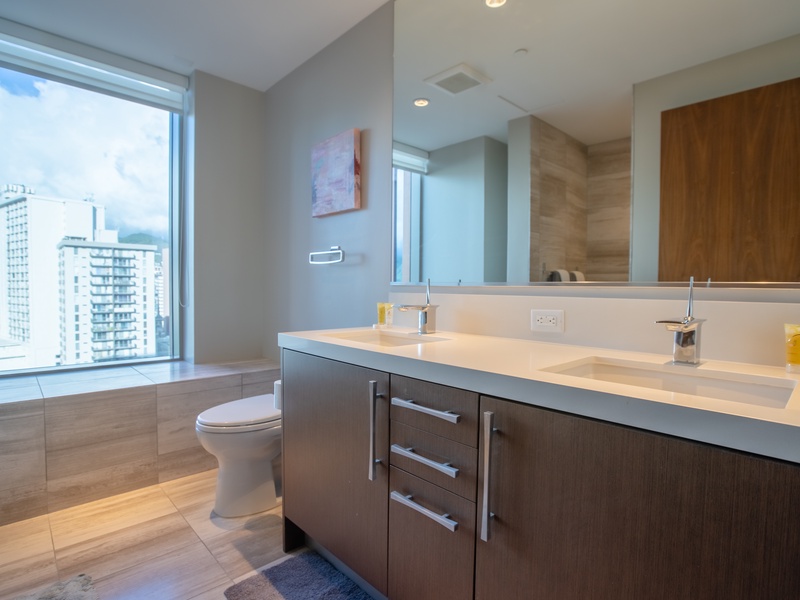 Bathroom with Double Sink and Window w/City View